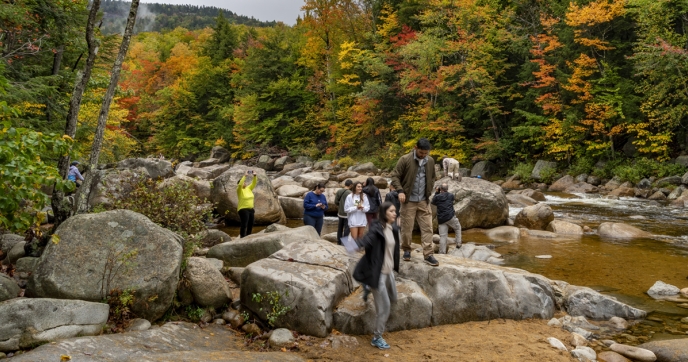 People hike in a state park in New Hampshire