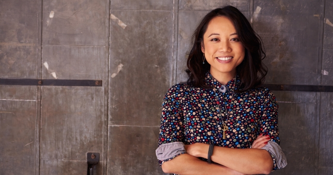 Woman standing in front of a wall